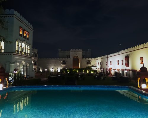 Relax by the swimming pool at The Fort Ramgarh