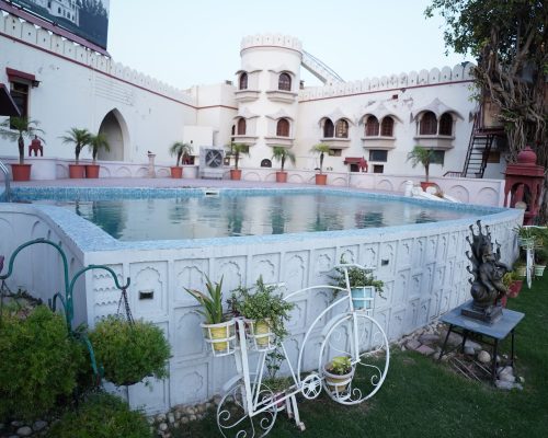 Relax by the swimming pool at The Fort Ramgarh in Panchkula